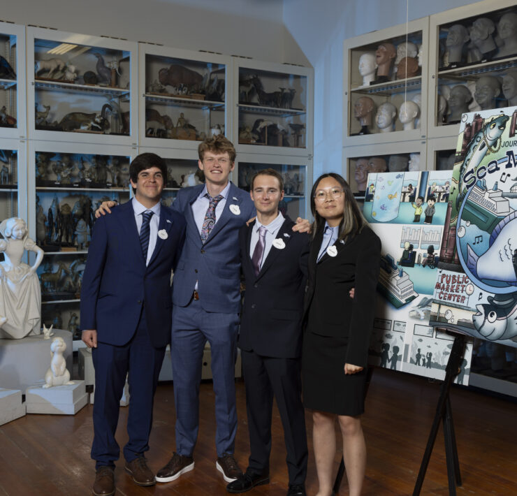 Cal Poly's "Team Pike" stands in front of their design